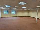 A wide angle photo of a large office