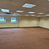 A wide angle photo of a large office