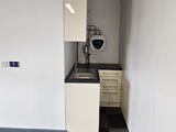 A kitchen within a room