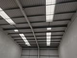 A high metal ceiling with windows
