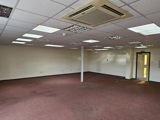 A wide angle photo of a large office