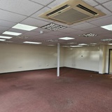 A wide angle photo of a large office