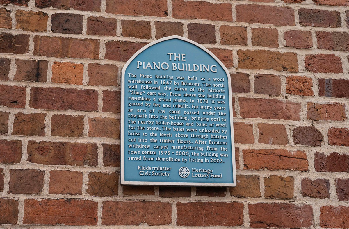 Blue wall sign for Piano Building